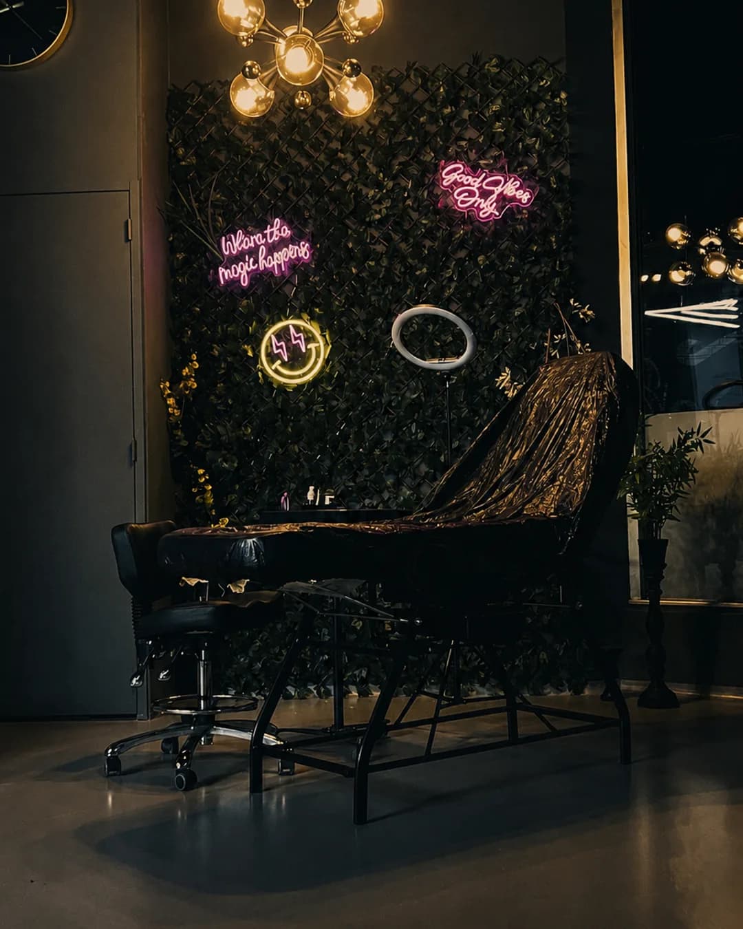 Neon-lit tattoo station at MagicTouch Tattoo Studio